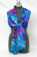 Load image into Gallery viewer, scarf_fashionably_tied_around_a_mannequin_with_a_dramatic_tie_dye_and_Celtic_design_gift_idea_from_Ireland