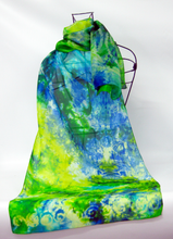 Load image into Gallery viewer, hand_painted_silk_scarf_on_a_wire_mannequin_blends_of_blue_and_yellow