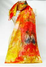 Load image into Gallery viewer, A_silk_scarf_painted_in_vibrant_shades_of_yellow_red_and_black_to-reflect_the_goldfinch_colours_with_a_wax_drawing_of_the_gold_finch_dispalyed_on_mannequinn_against_a_white_background
