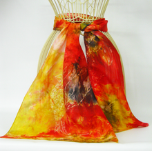 Load image into Gallery viewer, hand_painted_silk_scarf_tied_around_the_wire_body_in_vibrant_shades_and_the_delicate_wax_drawing_of_the_gold_finch_a_much_loved_garden_bird_the_scarf_is_dispalyed_in_front_of_a_white_background