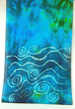 Load image into Gallery viewer, A_section_of_silk_shawl_featuring_a vibrant_turquoise_blue_and_green_tie-dye-background_with_white_hand-drawn_swirls_and_wavy_lines_across_the_lower_half_reprisenting_the_waves