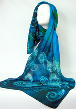 Load image into Gallery viewer, A_silk_shawl_displayed_worn_on_a_white_head_with_a_celtic_swan_design_inspired_by_the_Celtic_fairytale_the_Children_of_Lir_a_perfect_gift_from_Ireland