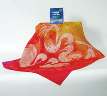 Load image into Gallery viewer, A_colourful_scarf_in_shades_of_a_sunset_wth_pink_red_and_yellow_with_a_hand_painted_swan_design