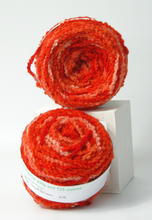 Load image into Gallery viewer, Hand_dyed_wool_in_shades_of_coral_and_salmon_perfect_for_small_knitting_or_crochet_projects_like_scarves_shrugs_hats_and_tank_tops
