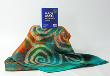 Load image into Gallery viewer, silk_satin_scarf_hand_painted_in_the_art_of_batik_with_celtic_spiral_design_in_autumnal_shades
