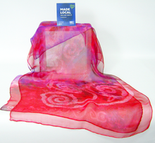 Load image into Gallery viewer, Red_and_pink_scarf_with_Celtic_spiral_design_'Made-Local'_displayed_in_front_of_a_white_background 
