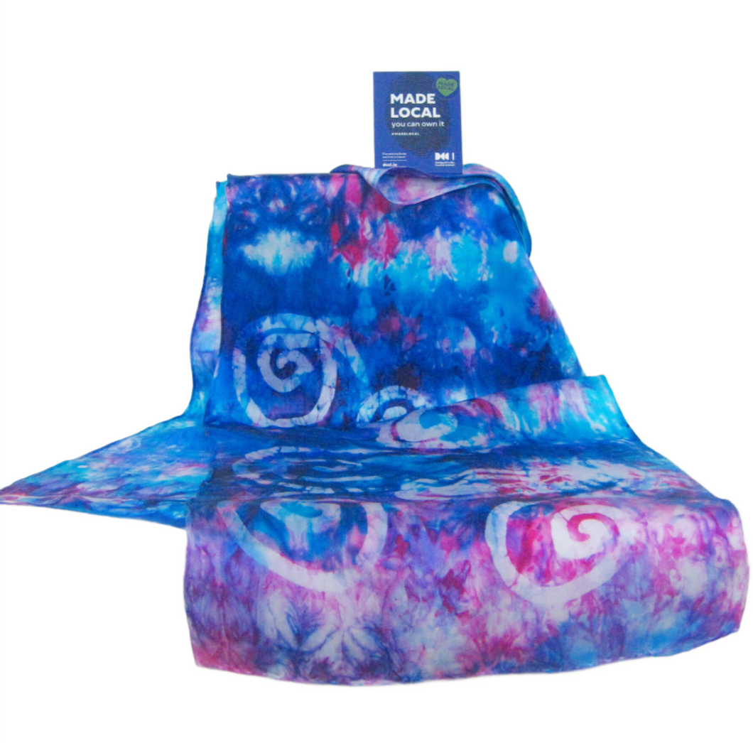 hand_painted_silk_scarf_in_shades_of_blue_and_Pink_with_celtic_spiral_design_done_in_batik