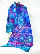 Load image into Gallery viewer, Hand_painted_silk_a_blend_of_green_blue_turquoise_and_pink_draped_over_a_wire_mannequinn_in_front_of_a_white-background
