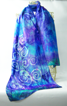 Load image into Gallery viewer, a_long_silk_scarf_in_bright_shades_of_blue_aqua_and_purple_a_dramatic_scarf_done_in_a_silk_habotai_a_wide_scarf_that_can_be_worn_as_a_shawl_for_evening_occassions
