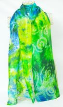 Load image into Gallery viewer, A_silk_scarf_in_shades_of_lemon_green_aqua_green_teal_green_and_flashes_of_brilliant_blue_with_a_hand_painted_celtic_design_in_soft_white_draped_over_a_mannequin_against_a_white_background
