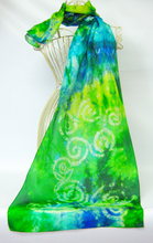Load image into Gallery viewer, A_light_weight_silk_scarf_with_a_Celtic_design_worn_on_a_mannequin_against_a_white_background_perfect_to_bring_colour_in_to_an_outfit
