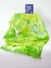 Load image into Gallery viewer, hand_painted_silk_scarf_draped_over_cube_with_the_madelocal_sign_colours_pale_green_pale_lemon
