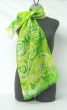 Load image into Gallery viewer, silk_scarf_hand_painted_green_with_pale_lemon_spirals_on_a mannequin
