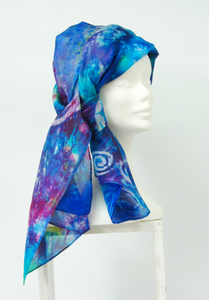blue_scarf_with_a_hand_painted_spiral_design_done_in_the_art_of_batik_other_colours_include_magenta_and_bright_aqua