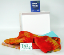 Load image into Gallery viewer, silk_scarf_dispalyed_with_gift_box_and_made_local_sign_in_front_of_a_white_backgrounde

