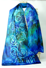 Load image into Gallery viewer, hand_painted_silk_scarf_by_louise_with_celtic_design_in_shades_of_turquoise_blue_and_green_perfect_for_adding_splahes_of_colour_to_winter_coats_and_suits
