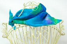 Load image into Gallery viewer, silk_bandana_tied_with_a_bow_around_the_neck_of_the_wire_mannequin_displaying_a_fashionable_way_to_wear_the_little_scarf
