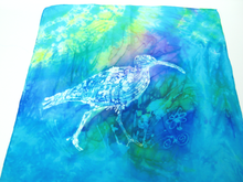 Load image into Gallery viewer, silk_square_hand_painted_in_turquoise_green_shades_with_a_white_wax_drawing_of_a_curlew_dispalyed_flat_on_a_white_background
