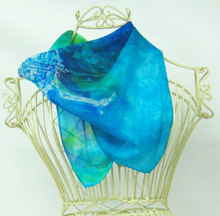 Load image into Gallery viewer, small_silk_square_worn_around_the_neck_of_a_cream_coloured_mannequin_Infront_of_a_white_background_a_little_scarf_perfect_for_adding_a_little_pop_of_colour
