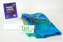 Load image into Gallery viewer, silk_bandana_folded_and_sitting_on_a_white_gift_box_with_the_madelocal_sign_and_louise_loughman_card_sitting_on_top
